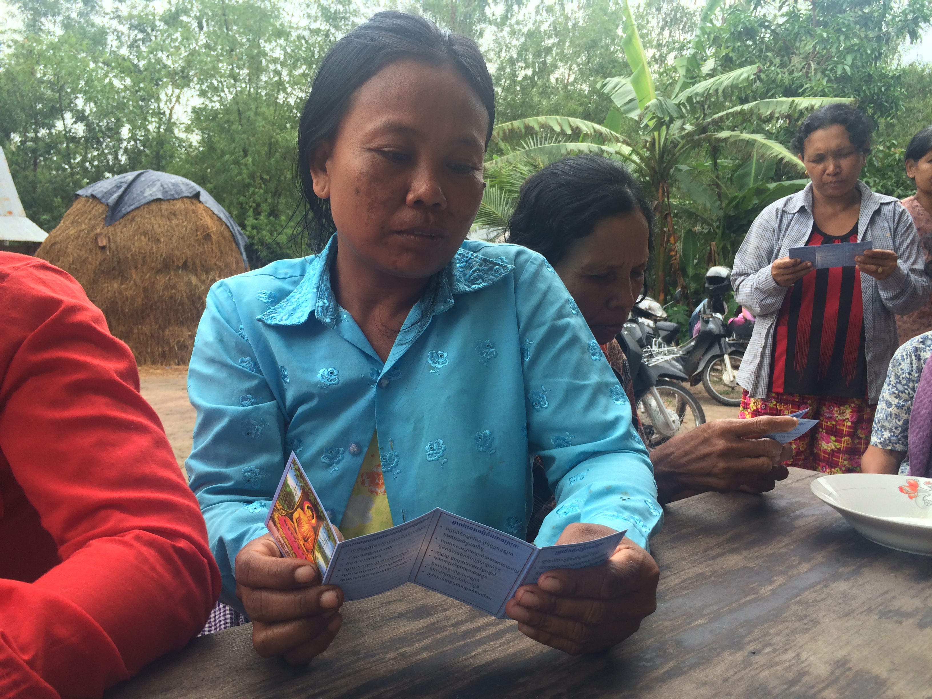 Woman Reading the leaflet of Human Trafficking 